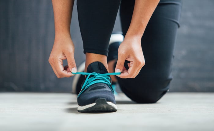 lacing up sneakers